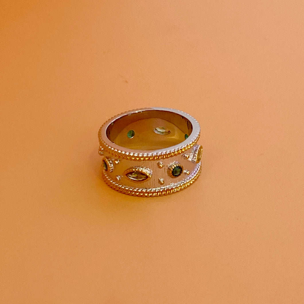 Anillo bicolor zirconias verdes